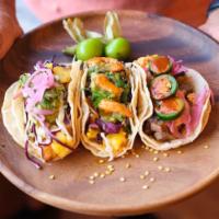 Any 3 Tacos With Rice And Beans · Choose any 3 tacos, served with a side of rice and beans.