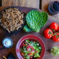 Carnitas Plato · Boneless citrus marinated pork shoulder with with rice, beans, salad, 3 tortillas, cotija ch...