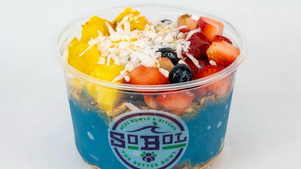 Spirulina Bowl · We blend frozen pineapple, spirulina, and bananas to make a thick fruit smoothie. We then parfait the puree between two layers of our homemade granola (contains nuts). The bowl is then topped with strawberries, pineapple, blueberries, a sprinkle of coconut, and a drizzle of honey. Please specify any allergies.