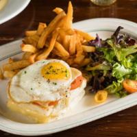 Croque Madame · Ham, swiss cheese, bechamel sauce and egg on top.