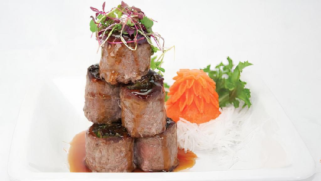 Negimaki · Scallion rolled with beef broiled in teriyaki sauce.