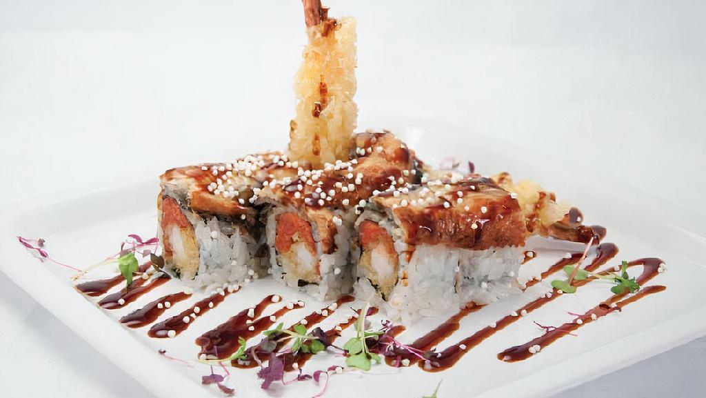 Ninja Roll · Shrimp tempura and spicy tuna topped with eel and eel sauce.