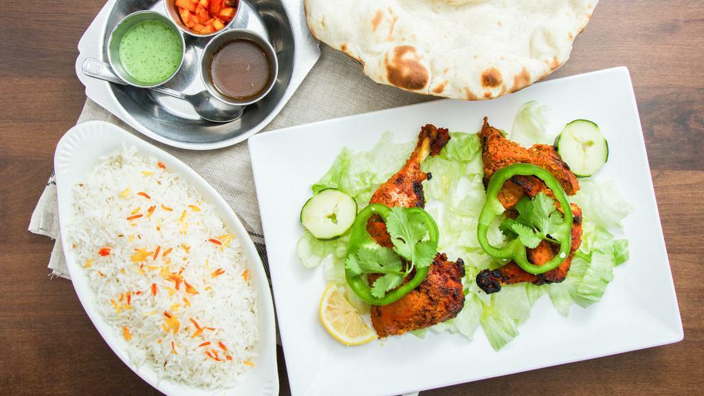 Chicken Tandoori · Spring chicken marinated in mild spices and barbecued.