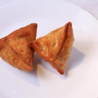 Samosa · Hand rolled pastry stuffed with potato and green peas.