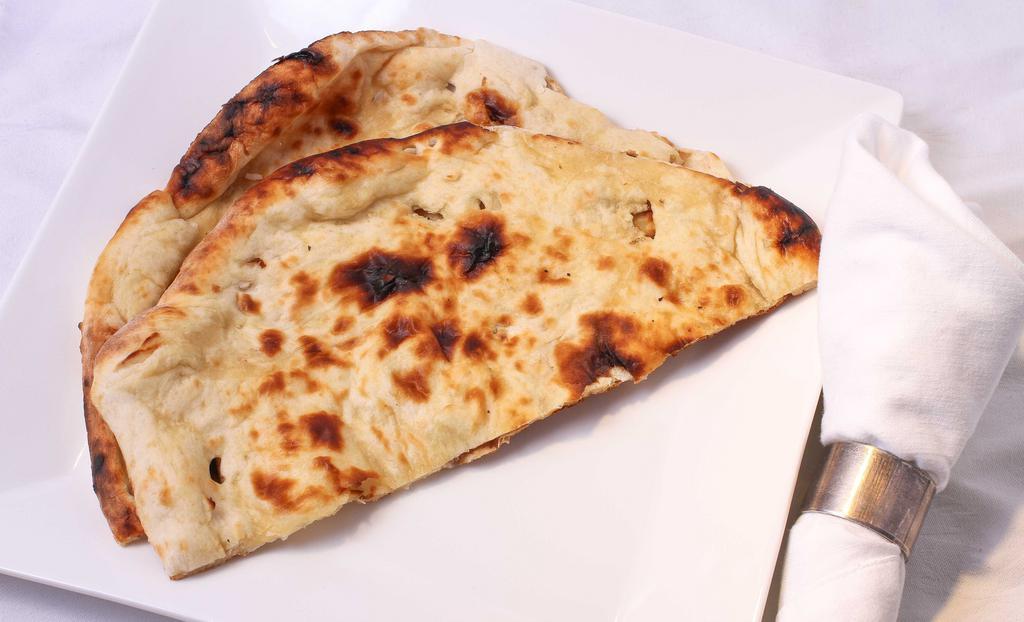 Naan · Traditional Indian bread baked in clay oven.