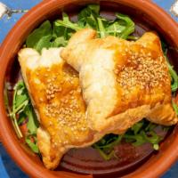 Bourekas · Puff pastry with sautéed shallots and spinach, walnuts, raisins and feta cheese.