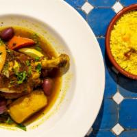Chicken Tagine · Braised with herbs and spices, preserved lemon and green olives, served with couscous.
