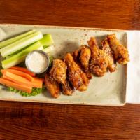 Chicken Wings · Buffalo or Asian Glaze, Blue Cheese or Ranch