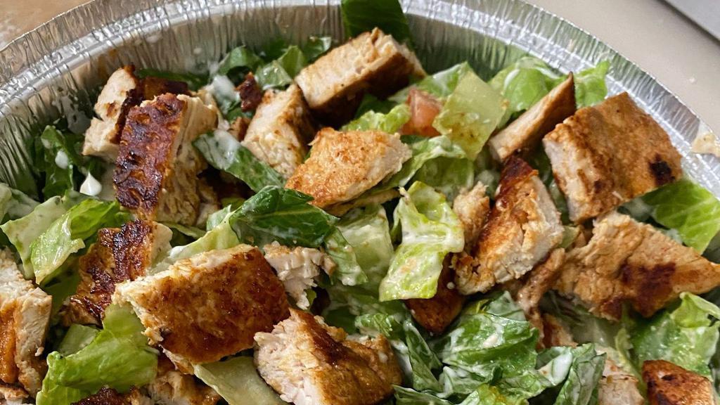 Caesar Salad With Grilled Chicken · Comes with romaine lettuce, grated cheese, grilled chicken, croutons, and hard boiled egg.