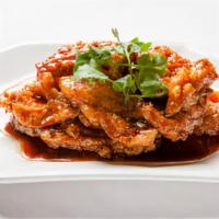 Peking Pork Chops 京都肉排 · Served with white rice.