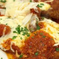 Chicken Parmesan Dinner · Breaded Chicken baked with Mozzarella, Romano, and Tomato Sauce.