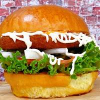 Fried Chickenless Burger · Fried Chickenless, Brioche bun, Lettuce, tomatoes, pickles, onion and chopotle sauce