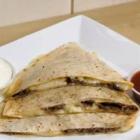 Vegetarian Quesadilla · Spinach, peppers, onions, and mushrooms.