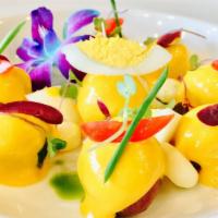 Papa A La Huancaina / Potato Huancaina Style · Patata hervida amarilla cubierta con pasta de ají amarillo. Acompañado por los huevos duros,...