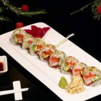 Tiger Roll · salmon tuna white fish kani avocado jalapeño masago inside and wrapped with marble paper