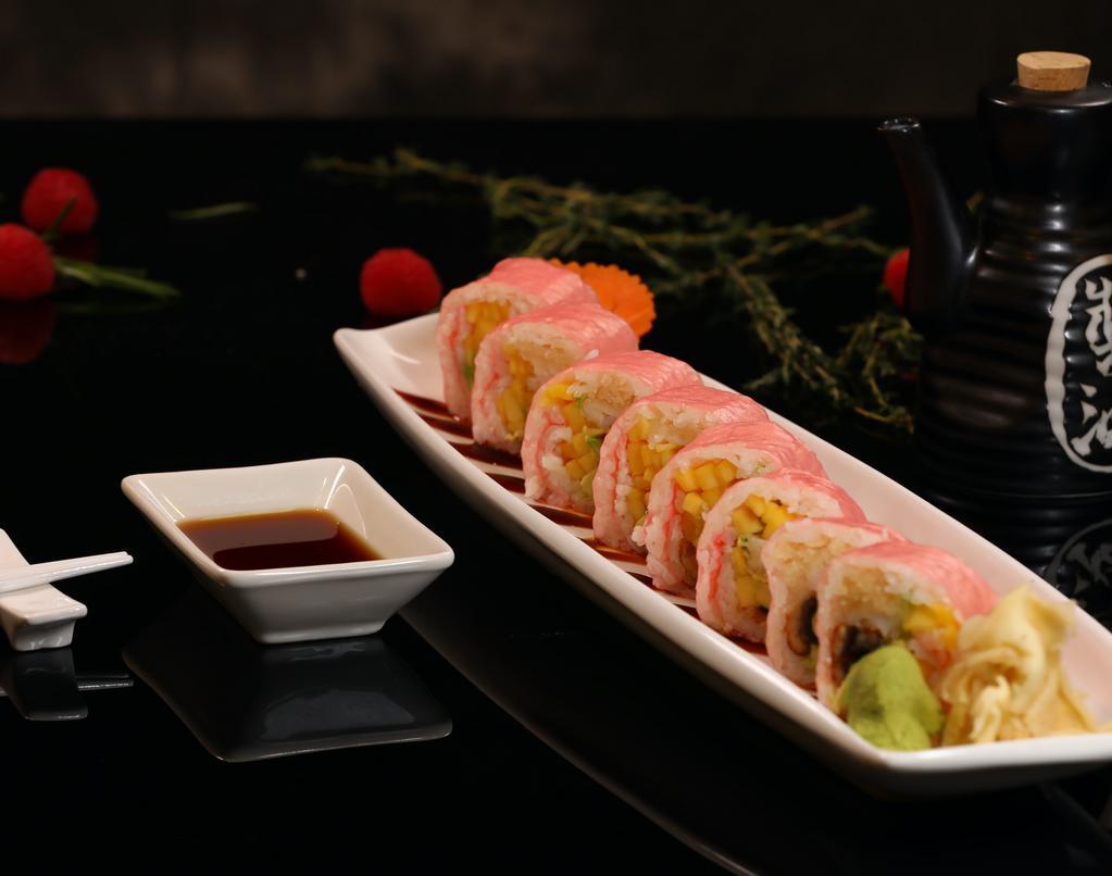 Idealist Roll · Lobster tempura, eel,avocado and mango inside, wrapped with soy paper and eel sauce.