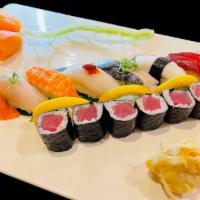 Sushi Deluxe · Served with miso soup/soda; 9 pcs assorted sushi with tuna roll.