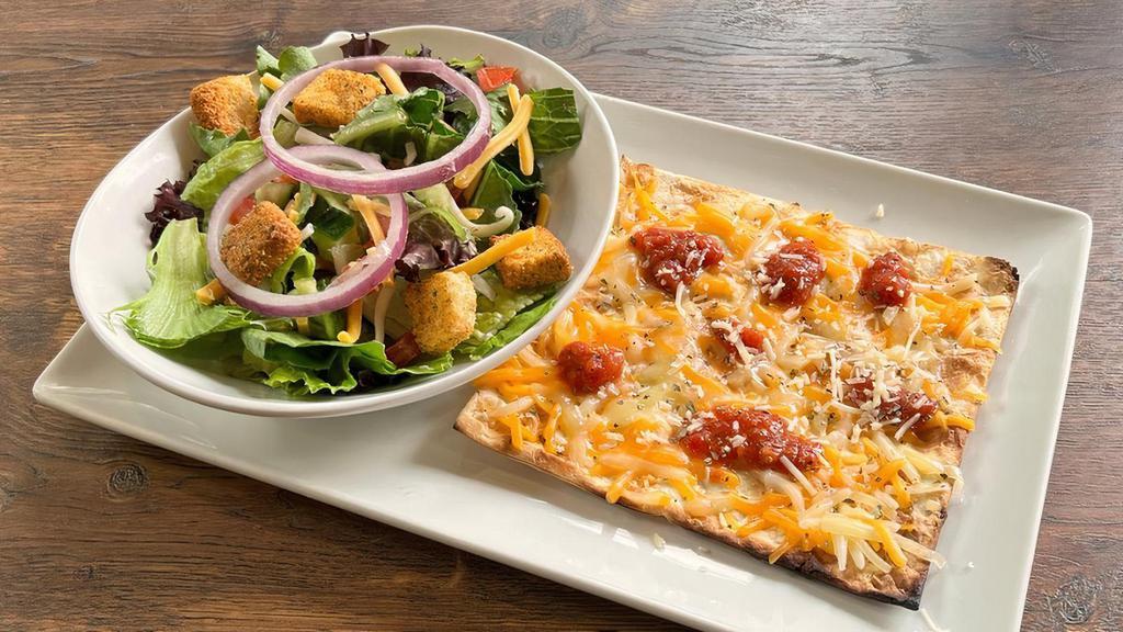 Half Four Cheese Flatbread And Salad Combo · Mozzarella, Monterey Jack, Cheddar and Parmesan cheeses, house-made marinara on a crispy golden brown thin crust. Served with choice of House or Caesar Salad