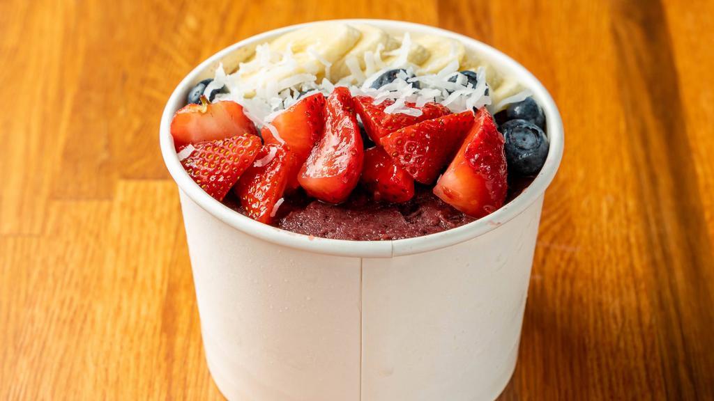 Açaí Bowl  · Blended açaí with strawberries, banana and a splash of coconut milk. Topped with two layers of granola, strawberries, blueberries, bananas shredded coconut and a drizzle of honey