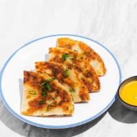 Scallion Pancake With Curry Sauce · Pan fried Chinese savory flat bread folded with scallions.
Served with yellow curry sauce.
C...