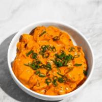 Tomato Butter Curry · Tomato butter sauce, coriander, cream, fenugreek leaves. 
Contains: Dairy