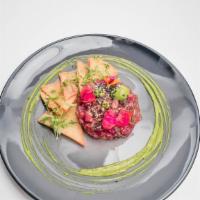 Tuna Tartare · with pressed avocado, soy, sesame and cucumber, finished with a Yuzu Citrus Emulsion
