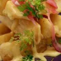 Papa’S Brava’S · Thick cut Yucca fries, pickled red onion, jalapeno queso