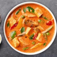 Red Curry Redemption · Coconut milk, bamboo shoot, bell pepper, and eggplant. Choice of protein and a side of rice....