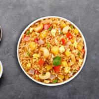 Pascal'S Pineapple Fried Rice · Stir fried rice with pineapple, onion, carrot, cashew nut, egg, tomato, and scallion.