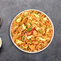 So Tum Yum Fried Rice · Stir fried rice with egg, mushroom, scallions, onions, bell pepper and lemongrass. Spicy.