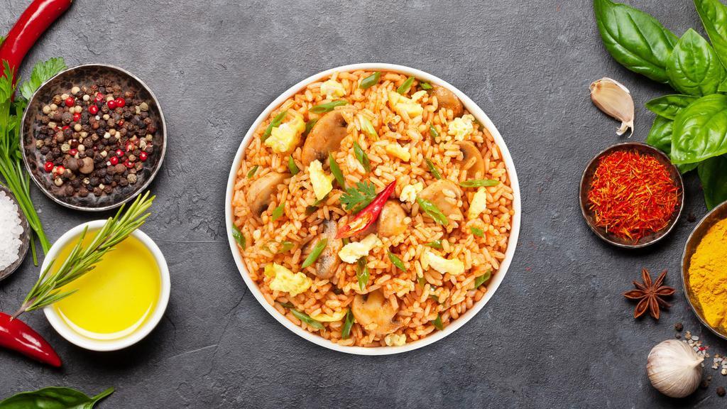 So Tum Yum Fried Rice · Stir fried rice with egg, mushroom, scallions, onions, bell pepper and lemongrass. Spicy.
