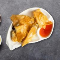Crab Rangoon · (6 pieces) Crab stick and cream cheese wrapped in wonton skin. Served with sweet chili sauce.