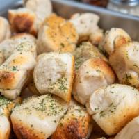 6 Garlic Knots · Popular.A classic snack, our garlic knots are strips of pizza dough tied in a knot, baked, a...