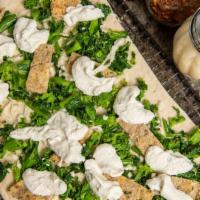 Broccoli Rabe Pizza · Sauteed broccoli rabe with fresh mozzarella on our delicious dough!