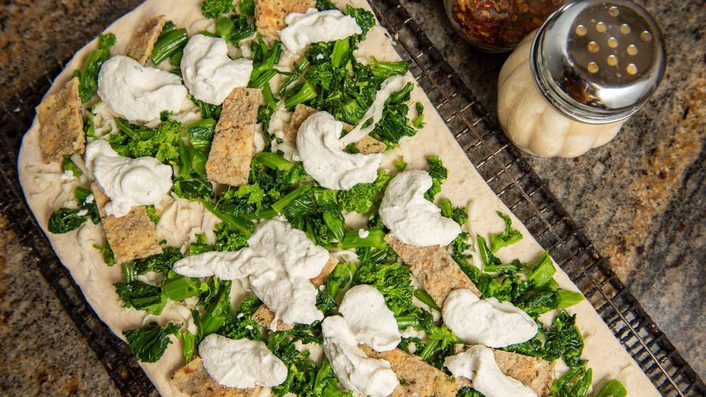 Broccoli Rabe Pizza · Sauteed broccoli rabe with fresh mozzarella on our delicious dough!