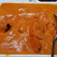 Chicken Tikka Masala · Marinated sliced chicken grilled & cooked in creamy sauce