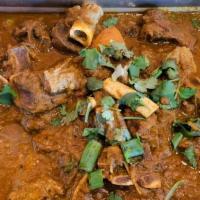 Lamb Curry · Lamb pieces cooked in a house special curry sauce with traditional spices