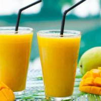 Mango Passion Smoothie · Freshly blended smoothie with Mango, Banana, and Spirulina Fruit Juice.