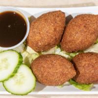 Kibbeh (4 Pieces) · Halal. A deep-fried oval-shaped mixture of cracked wheat and spices- stuffed with cooked gro...