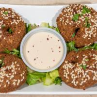 Falafel (4 Pieces) · Vegetarian. A deep-fried mixture of ground chickpeas, onions, and spices. Served with Tahini...