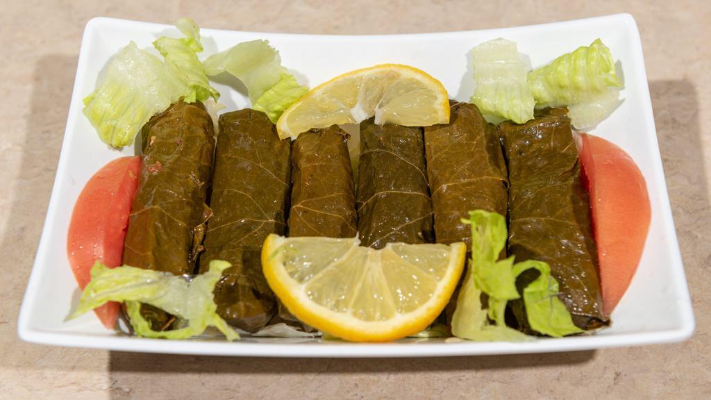 Grape Leaves (6 Pieces) · Vegetarian. Grape leaves stuffed with rice, tomatoes, parsley and cooked in delicious lemon juice.