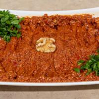 Muhammara · Spicy. Fresh red pepper, ground walnuts, bread crumbs, olive oil, pomegranate molasses, shat...
