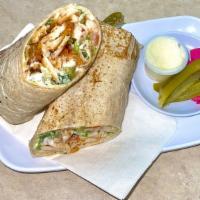 Chicken Shawarma · Halal. Chicken shawarma, Lettuce, Tomato's,  pickles, and garlic sauce wrapped in Markook br...