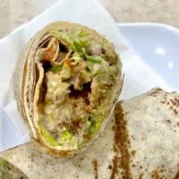 Falafel Sandwich · Vegetarian. Falafel, tahini sauce, pickles, lettuce, tomatoes, and parsley wrapped in Markoo...