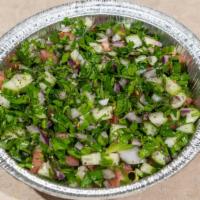 Arabic Salad · Tomatoes, cucumbers, parsley, mint, olive oil, onions and lemon juice.