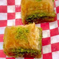 Pistachio Baklava - 2 Pieces  · Rich, sweet pastry made of layers of filo filled with chopped pistachios, sweetened and held...