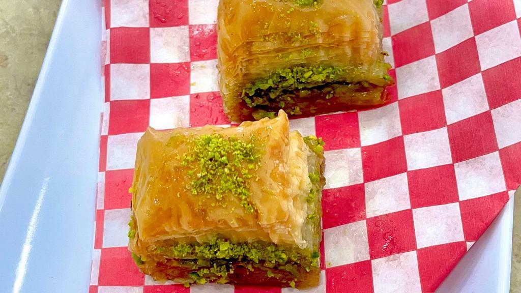 Pistachio Baklava - 2 Pieces  · Rich, sweet pastry made of layers of filo filled with chopped pistachios, sweetened and held together with syrup.