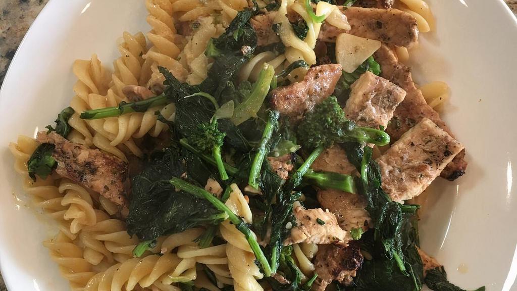 Fusilli Casalinga · Corkscrew shaped pasta tossed with fresh broccoli rabe and grilled chicken strips, sautéed in a light roasted garlic and extra virgin olive oil sauce.