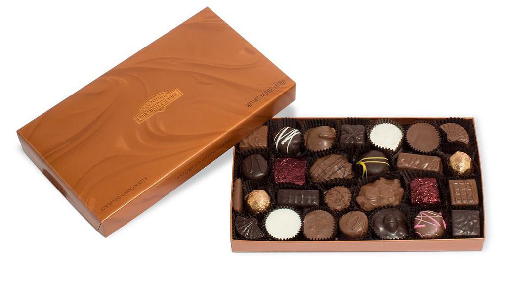 Assorted Chocolate Gift Box · Single layer of nutty clusters, butter creams, chewy caramels and Peanut Butter Pails™ in milk and dark chocolate and white confection. Serving size: 2 pieces