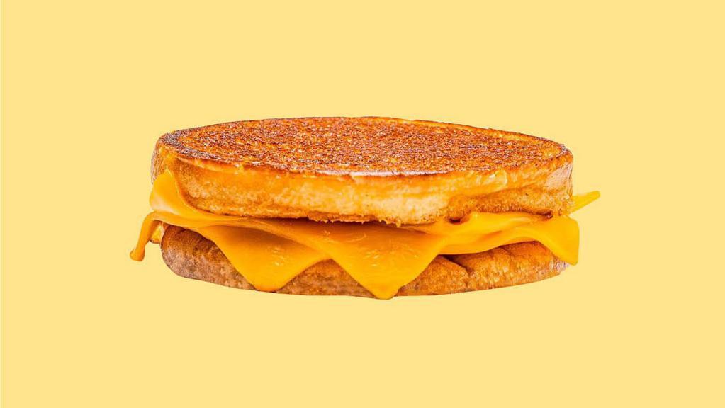 Karl’S Grilled Cheese  · 3 slices of American cheese griddled crisp on an inverted bun.